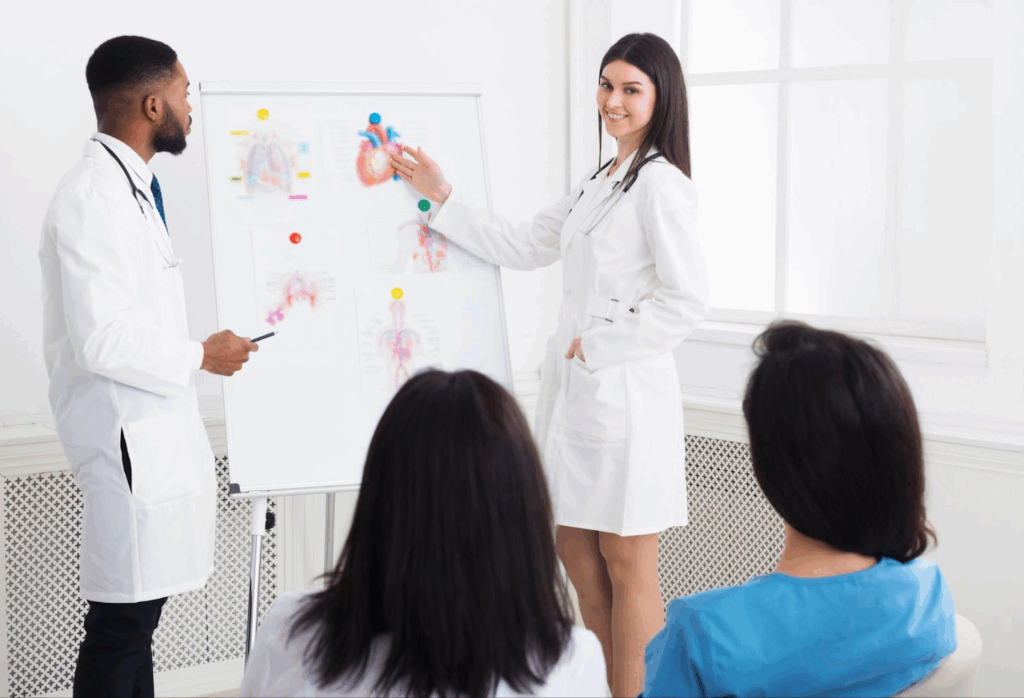 A team of practitioners give healthcare training lectures to interns.